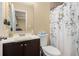 Bathroom features a vanity with sink and a shower/tub with a floral shower curtain at 258 Cristy Dr, Dallas, GA 30157