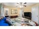 Bright bedroom featuring neutral walls, ceiling fan, and ensuite bathroom at 258 Cristy Dr, Dallas, GA 30157