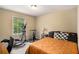 Bedroom featuring exercise equipment, a ceiling fan and a large window providing plenty of natural light at 258 Cristy Dr, Dallas, GA 30157