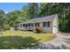 Exterior showcasing the side of the home with an attached garage and a lush green lawn at 258 Cristy Dr, Dallas, GA 30157