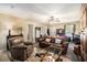 Open living room with comfortable seating, a ceiling fan, and a decorative area rug at 258 Cristy Dr, Dallas, GA 30157