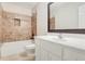 Bathroom with a tub, shower, neutral paint and a single sink with a white vanity at 3570 Bulloch Lake Rd, Loganville, GA 30052