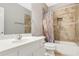 Bathroom with a tub, shower, neutral paint and a single sink with a white vanity at 3570 Bulloch Lake Rd, Loganville, GA 30052