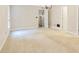 Bright bedroom features neutral carpeting and chandelier lighting fixture at 3570 Bulloch Lake Rd, Loganville, GA 30052