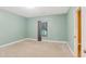 Spacious bedroom with soft green walls and neutral carpeting at 3570 Bulloch Lake Rd, Loganville, GA 30052