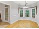 Bright dining area with hardwood floors and natural light from large windows at 3570 Bulloch Lake Rd, Loganville, GA 30052