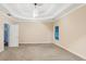 Spacious main bedroom with plush carpet, ceiling fan, and natural light at 3570 Bulloch Lake Rd, Loganville, GA 30052