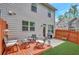 Cozy backyard features a wood deck, patio, grill, and privacy fence at 4974 Whiteoak Walk Se # 21, Smyrna, GA 30080