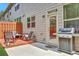 Cozy backyard features a wood deck, patio, grill, and privacy fence at 4974 Whiteoak Walk Se # 21, Smyrna, GA 30080