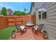 Cozy backyard features a wood deck, patio, chairs, and privacy fence at 4974 Whiteoak Walk Se # 21, Smyrna, GA 30080
