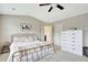 Cozy bedroom with a metal bed frame, soft lighting, and a full dresser set at 4974 Whiteoak Walk Se # 21, Smyrna, GA 30080