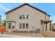 Exterior of home with multi-pane windows and a landscaped yard at 4974 Whiteoak Walk Se # 21, Smyrna, GA 30080
