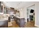 Modern kitchen with stainless steel appliances, center island and view of the living room at 4974 Whiteoak Walk Se # 21, Smyrna, GA 30080