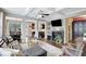 Open-concept living room with coffered ceilings, fireplace, and seamless flow to the dining area at 4974 Whiteoak Walk Se # 21, Smyrna, GA 30080