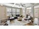 Spacious living room with coffered ceilings, hardwood floors, and an abundance of natural light at 4974 Whiteoak Walk Se # 21, Smyrna, GA 30080