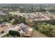 An aerial view of the home displaying a large lawn, community buildings, and surrounding green spaces at 52 Weatherstone Way, Dallas, GA 30157