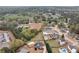 Aerial view of a neighborhood showcasing the community with mature trees and several homes with pools at 52 Weatherstone Way, Dallas, GA 30157