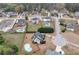 Aerial view of home featuring a pool, lush trees, and an expansive yard at 52 Weatherstone Way, Dallas, GA 30157