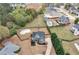Aerial view of home featuring a pool, lush trees, and an expansive, well-maintained yard at 52 Weatherstone Way, Dallas, GA 30157
