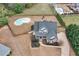 Aerial view of home with pool and backyard playground, surrounded by mature trees at 52 Weatherstone Way, Dallas, GA 30157