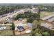 Expansive aerial view of a residential area with a community pool, playground, and well-manicured lawns at 52 Weatherstone Way, Dallas, GA 30157