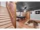 Basement boasts a pool table and brick accent wall, ideal for entertainment and relaxation at 52 Weatherstone Way, Dallas, GA 30157