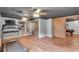 Finished basement with wood-look flooring, a sliding barn door, and a treadmill at 52 Weatherstone Way, Dallas, GA 30157