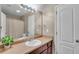 Bathroom with a large mirror, spacious counter, and white door at 52 Weatherstone Way, Dallas, GA 30157