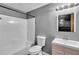 Clean bathroom features a shower-tub combo and modern vanity, perfect for everyday comfort and convenience at 52 Weatherstone Way, Dallas, GA 30157