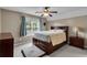 Comfortable bedroom featuring a ceiling fan, large windows, and a spacious bed at 52 Weatherstone Way, Dallas, GA 30157