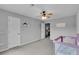 Room with a crib, modern furniture, and ceiling fan at 52 Weatherstone Way, Dallas, GA 30157