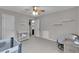 Room with a crib, modern furniture, and ceiling fan at 52 Weatherstone Way, Dallas, GA 30157