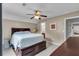 Cozy bedroom with a comfortable bed, ceiling fan, and modern décor at 52 Weatherstone Way, Dallas, GA 30157