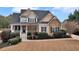 Charming two-story home featuring stone accents, a welcoming porch, and beautifully landscaped front yard at 52 Weatherstone Way, Dallas, GA 30157