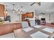 Kitchen leading to living room with granite countertops, stainless steel appliances, and open design at 52 Weatherstone Way, Dallas, GA 30157