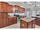 Well-equipped kitchen featuring stainless steel appliances, granite countertops, and an island at 52 Weatherstone Way, Dallas, GA 30157