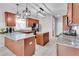 Kitchen with granite countertops, stainless steel appliances, kitchen island, and tiled floors at 52 Weatherstone Way, Dallas, GA 30157