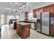 Spacious kitchen with a central island, stainless steel appliances, and ample natural light at 52 Weatherstone Way, Dallas, GA 30157