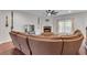 Spacious living room featuring hardwood floors, a stone fireplace, and comfortable seating arrangement at 52 Weatherstone Way, Dallas, GA 30157