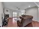 Bright living room with hardwood floors, a stone fireplace, and an open layout to the rest of the house at 52 Weatherstone Way, Dallas, GA 30157