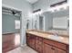 Main bathroom with dual sinks, spacious counters, a soaking tub and natural light at 52 Weatherstone Way, Dallas, GA 30157