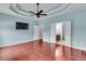 The main bedroom features hardwood floors, a tray ceiling, and access to the bathroom at 52 Weatherstone Way, Dallas, GA 30157