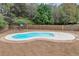 Backyard inground pool with brick surround, playground, and tall privacy fence at 52 Weatherstone Way, Dallas, GA 30157