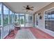 Relax on the spacious screened porch featuring outdoor furniture at 52 Weatherstone Way, Dallas, GA 30157