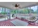 Relax on the screened-in porch with an outdoor kitchen and lounge furniture at 52 Weatherstone Way, Dallas, GA 30157