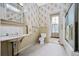 Bright bathroom with dual vanity, marble countertop, and classic white tiling at 285 Kennesaw Nw Ave, Marietta, GA 30060