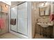 Bathroom featuring a shower and a sink with marble countertop at 285 Kennesaw Nw Ave, Marietta, GA 30060