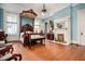 Large bedroom with a canopy bed, fireplace, hardwood floors, and plenty of natural light from the large windows at 285 Kennesaw Nw Ave, Marietta, GA 30060