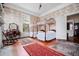 Bedroom with twin canopy beds, a large window, decorative rugs, and floral wallpaper at 285 Kennesaw Nw Ave, Marietta, GA 30060