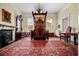 Bedroom with four-poster bed, fireplace, hardwood floors, and plenty of natural light from two windows at 285 Kennesaw Nw Ave, Marietta, GA 30060